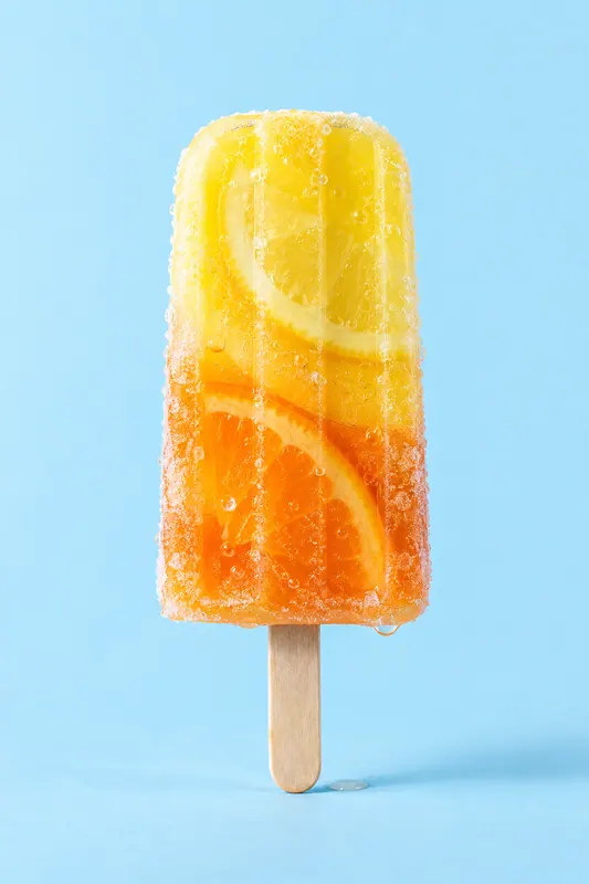 A layered citrus ice lolly